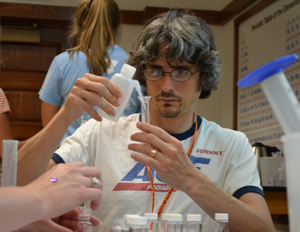 EnLiST teacher does a hands-on project during chemistry professional development.
